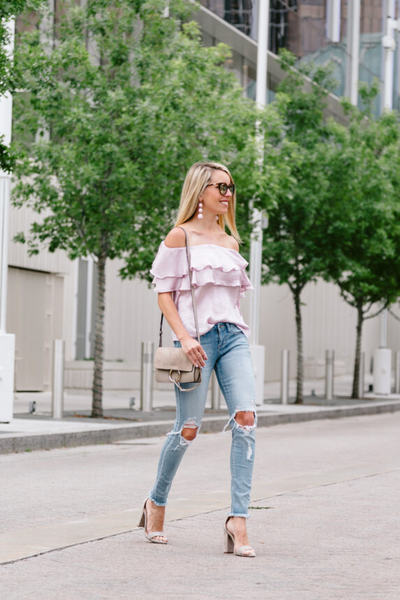 ankle cropped jeans, cross-body handbag, lavender hued satin top, spring heels, blush earrings