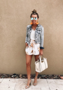 lemon print shorts - lemon shorts - graphic print shorts - white tank - white cami - orange earrings - denim jacket - crop denim jacket - shorts under $130