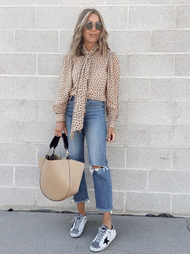 jaime shrayber wearing Levi’s wedgie icon fit ripped straight leg jeans with leopard golden goose sneakers